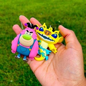 Two keychains from the movie lilo and stitch and one from the powerpuff girls